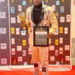 stanbelove with his award and certificate at the just ended Ghana Merit Awards 21