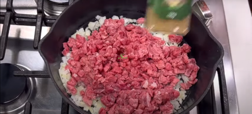 adding of meat to make meat pie